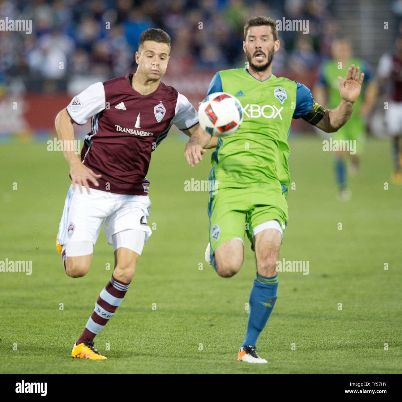 Commerce City, Colorado, USA. 23rd Apr, 2016. Rapids F LUIS SOLIGNAC, right, and Sounders D BRAD EVANS, right, battle for a long ball during the 1st. Half at Dicks Sporting Goods Park Saturday evening. The Rapids beat the Sounders 3-1. Credit:  Hector Acevedo/ZUMA Wire/Alamy Live News Stock Photo