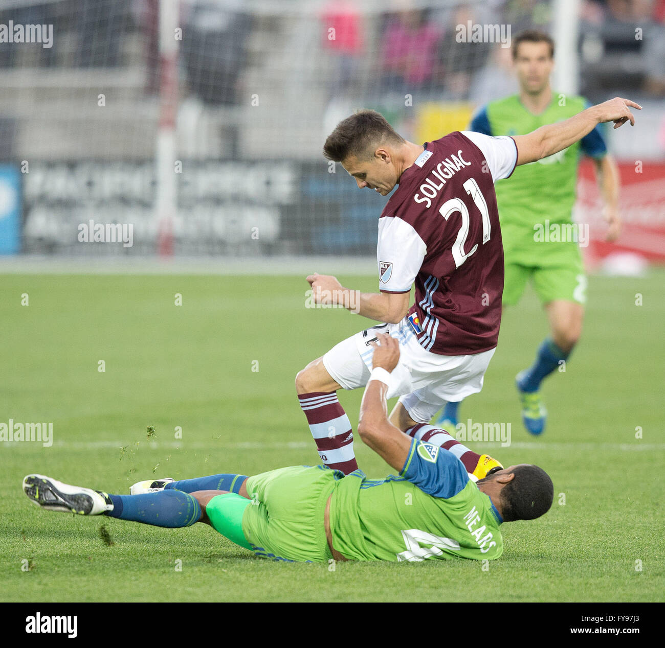 Commerce City, Colorado, USA. 23rd Apr, 2016. Rapids F LUIS SOLIGNAC, top center, gets pulled down by Sounders D TYEONE MEARS, bottom, during the 1st. Half at Dicks Sporting Goods Park Saturday evening. The Rapids beat the Sounders 3-1. Credit:  Hector Acevedo/ZUMA Wire/Alamy Live News Stock Photo