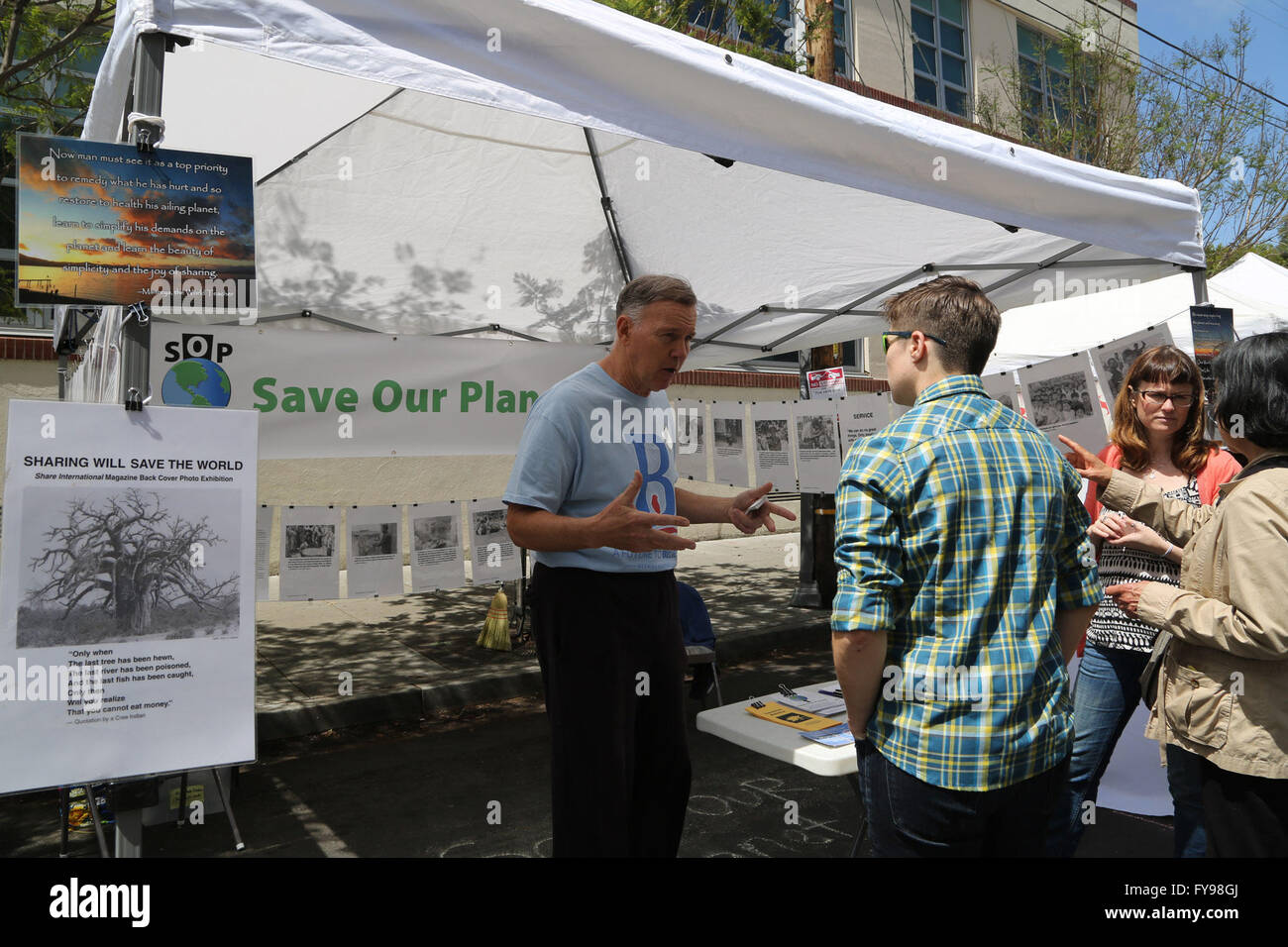 San Francisco, USA. 23rd Apr, 2016. An Earth Day event worker (L) educates visitors about environmental protection in downtown San Francisco, the United States, on April 23, 2016. The annual Earth Day San Francisco Street Fest was held in San Francisco on Saturday. Environmental activists brought the public an educational and entertaining green event to help raise their ecological awareness. © Liu Yilin/Xinhua/Alamy Live News Stock Photo
