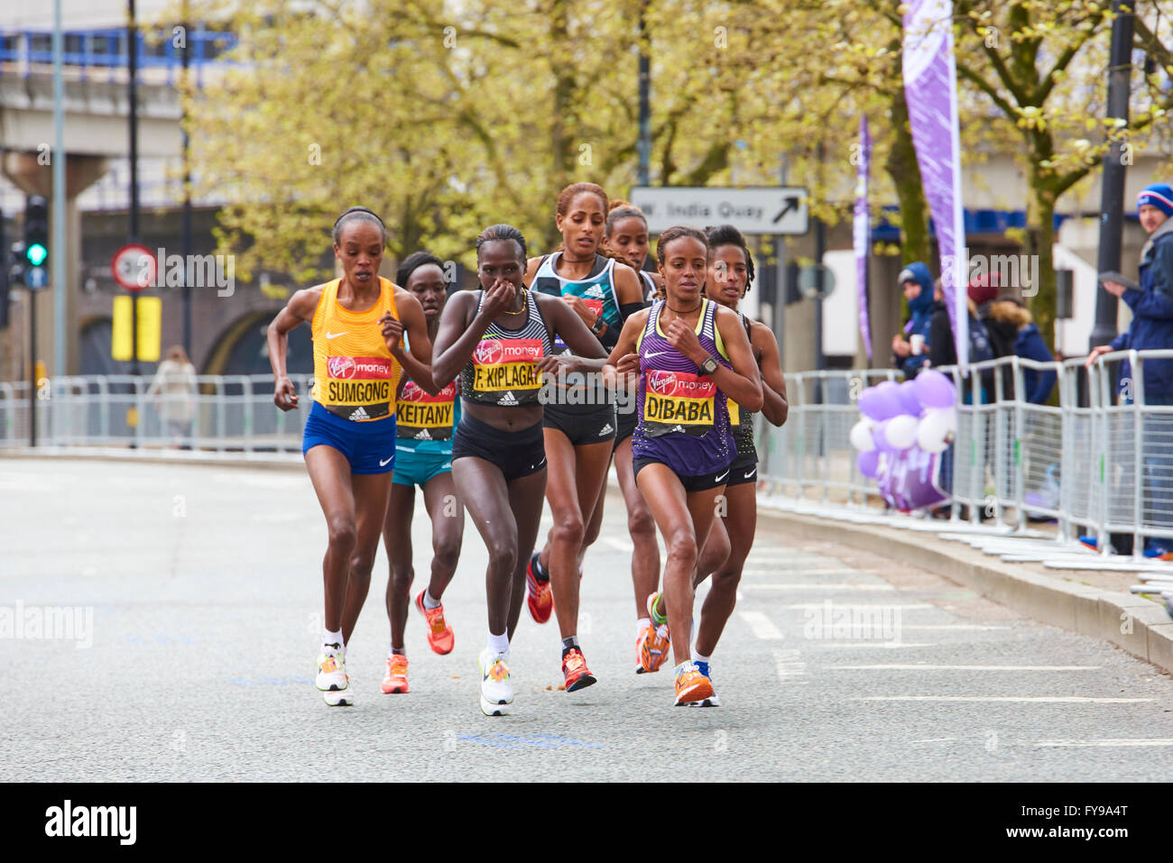 LONDON, UK - APRIL 24, 2016: Elite Women's Race leaders group competing for first position on the Virgin Money London Marathon 2016. Shot on the 20 mile stretch, on West India Dock Road. Stock Photo