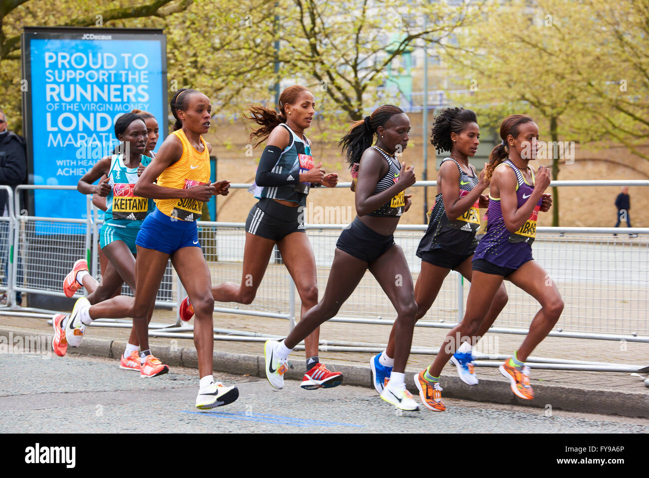 LONDON, UK - APRIL 24, 2016: Elite Women's Race leaders group competing for first position on the Virgin Money London Marathon 2016. Shot on the 20 mile stretch, on West India Dock Road. Stock Photo