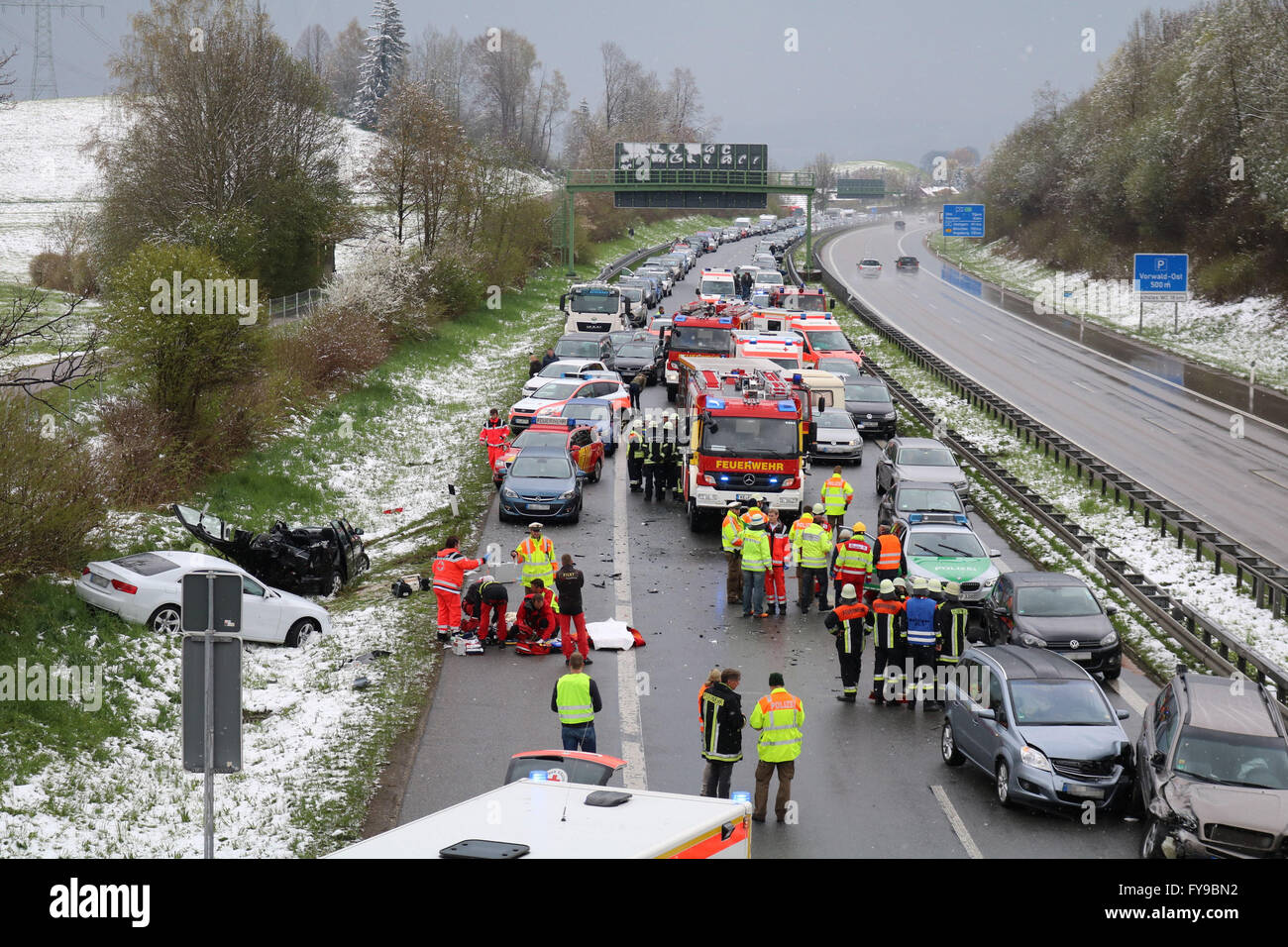 A7 motorway near Betzigau, Germany. 24th April, 2016. Emergency and rescue services are at work on the A7 motorway near Betzigau, germany, 24 April 2016. Several passengers were injured and cars damaged during a mass crash on the motorway due to the ice and snow slippery surface. Credit:  dpa picture alliance/Alamy Live News Stock Photo