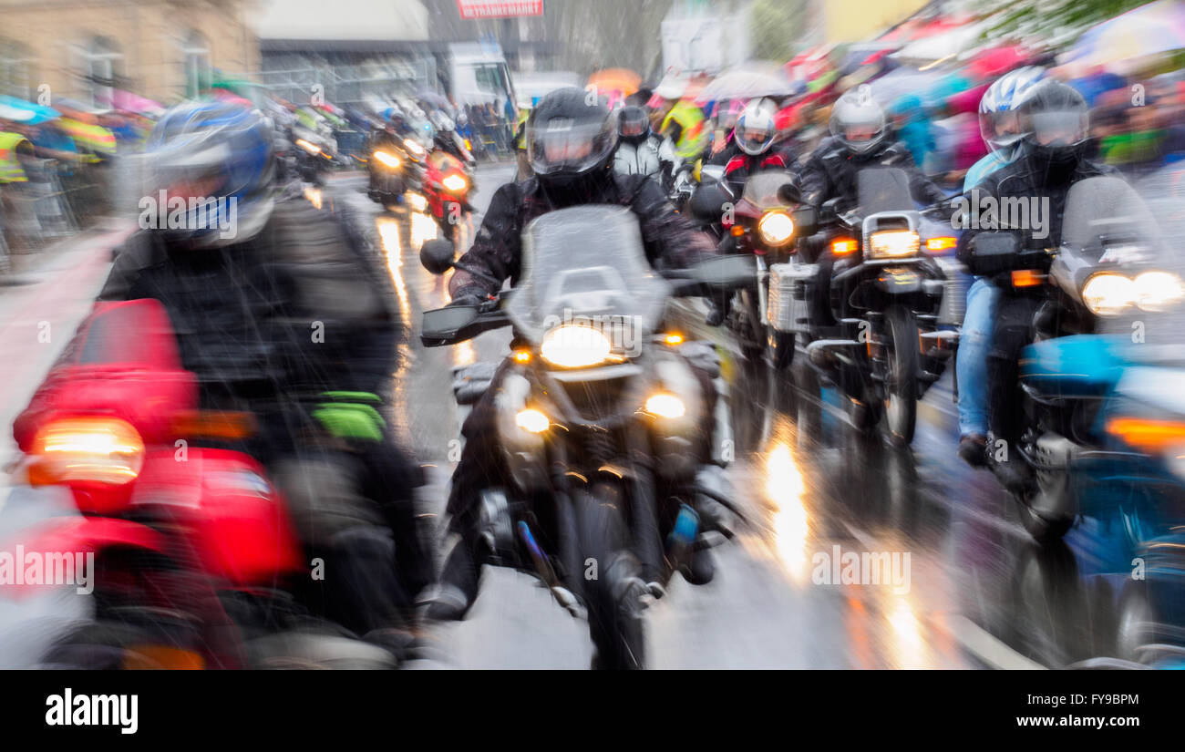 Motorcyclists drive in a procession through the town of Kulmbach, Germany, 24 April 2016. More than 1,000 motorcycle enthusiasts have come toegther for the traditional 16th 'Motorrad-Sternfahrt' (Motorcycle procession). Photo: Nicolas Armer/dpa (EDITORIAL NOTE: picture taken with long time exposure) Stock Photo