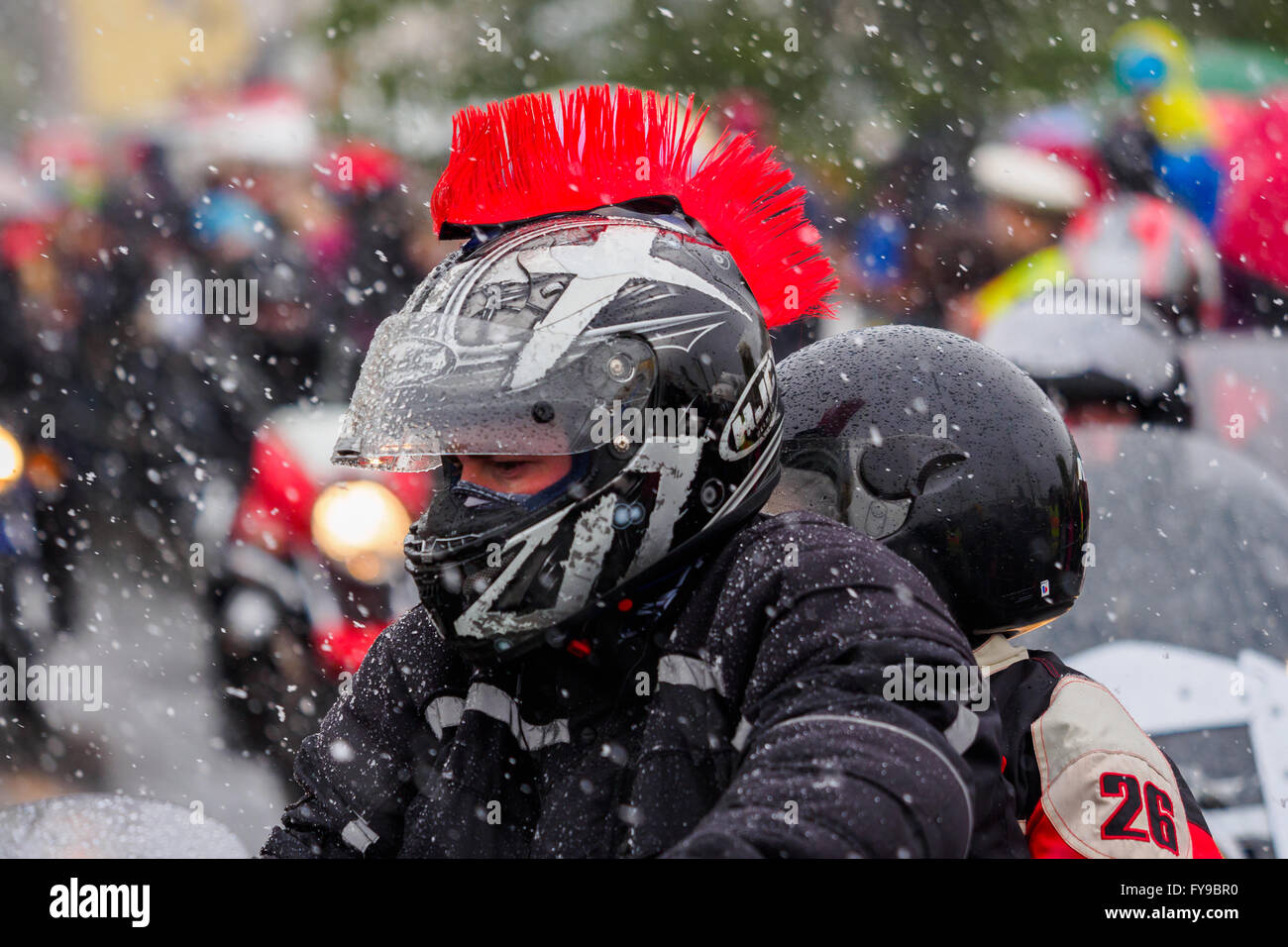 Motorcyclist drive in a procession through the town of Kulmbach, Germany, 24 April 2016. More than 1,000 motorcycle enthusiasts have come toegther for the traditional 16th 'Motorrad-Sternfahrt' (Motorcycle procession). Photo: Nicolas Armer/dpa (EDITORIAL NOTE: picture taken with long time exposure) Stock Photo
