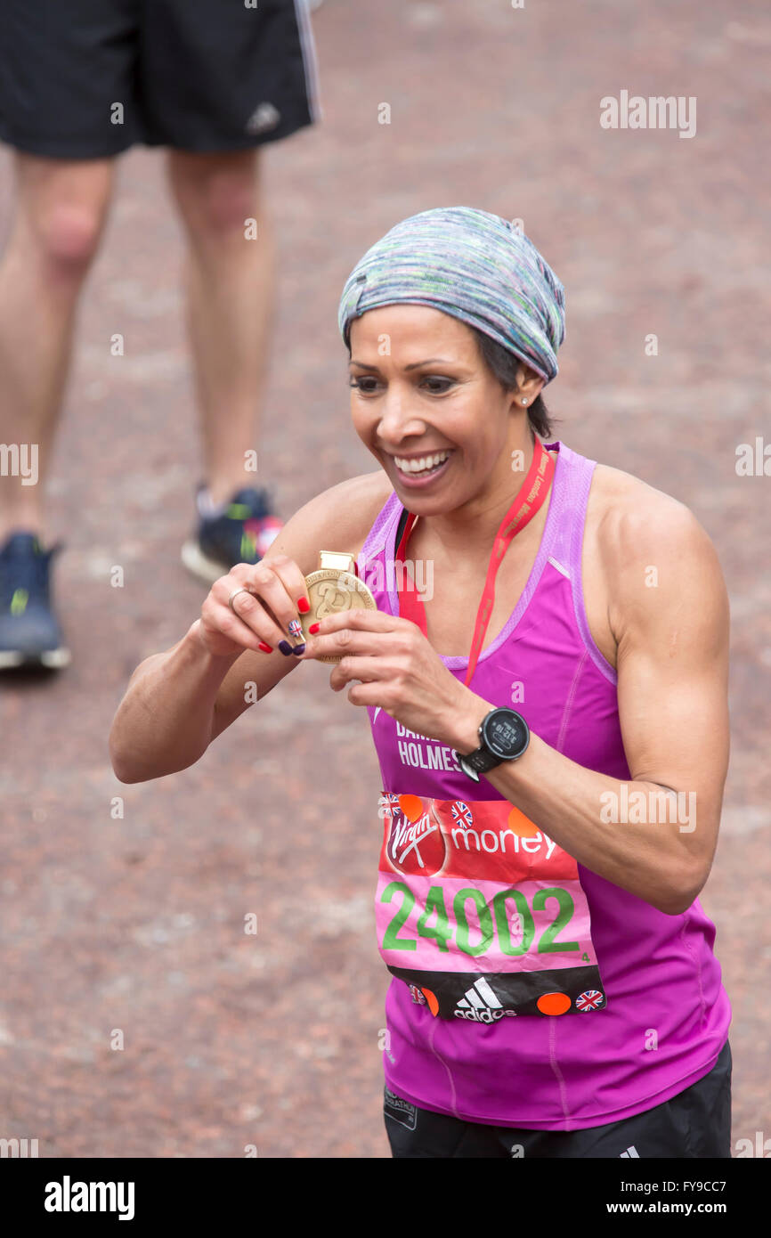London,UK,24th April 2016,Dame Kelly Holmes holds her medal proudly with multi coloured finger nails incuding the union jack flag after completing the Virgin London Marathon 201 Credit: Keith Larby/Alamy Live News Stock Photo