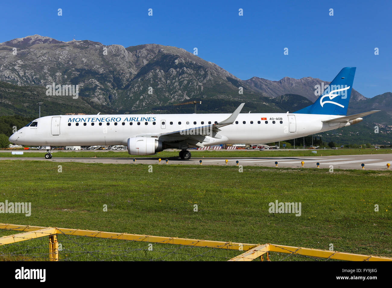 Montenegro Airlines Embraer 190 vacates runway 32 at Tivat airport