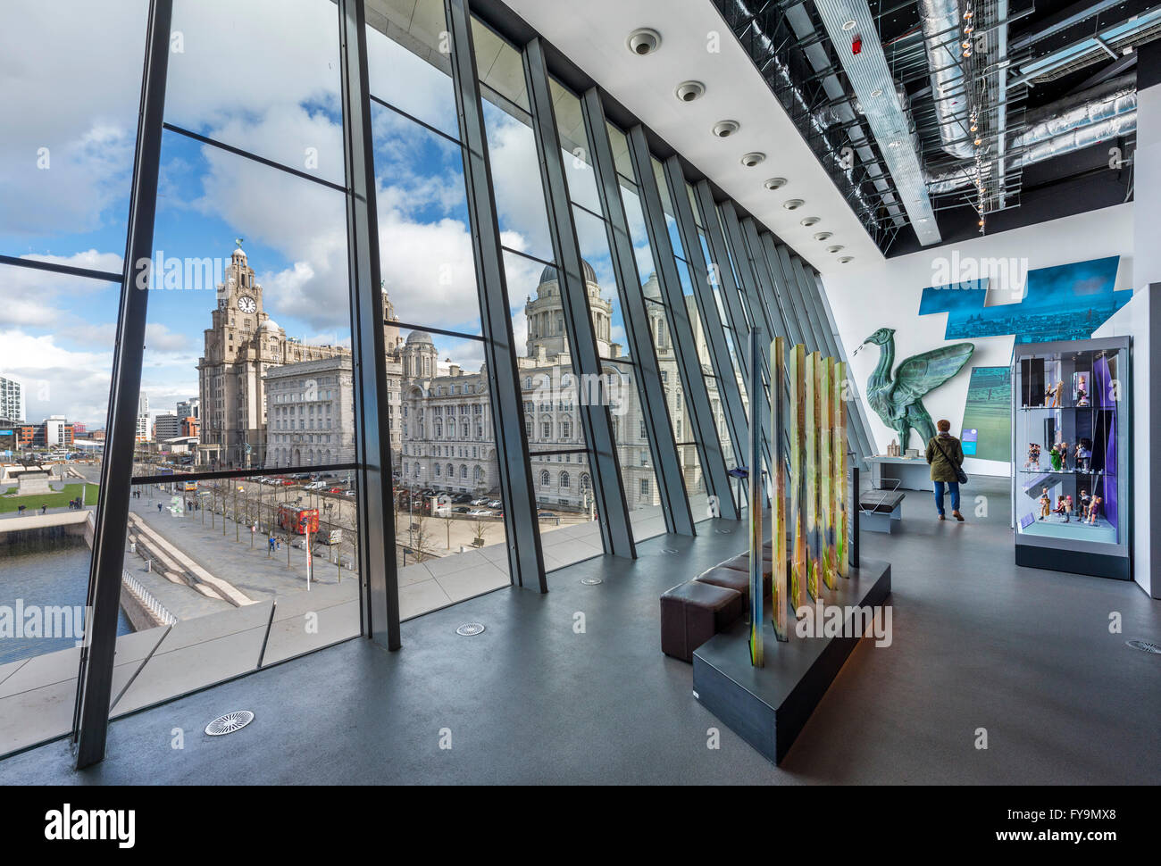 Interior of the Museum of Liverpool looking out over the Three Graces, Pier Head, Liverpool, Merseyside, England, UK Stock Photo