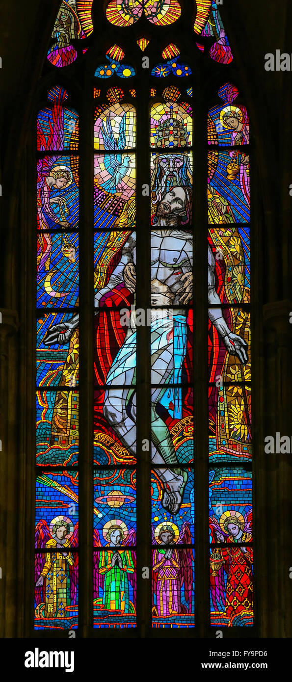 Stained Glass window in St. Vitus Cathedral, Prague, depicting the Holy Trinity, Father, Son and Holy Spirit Stock Photo