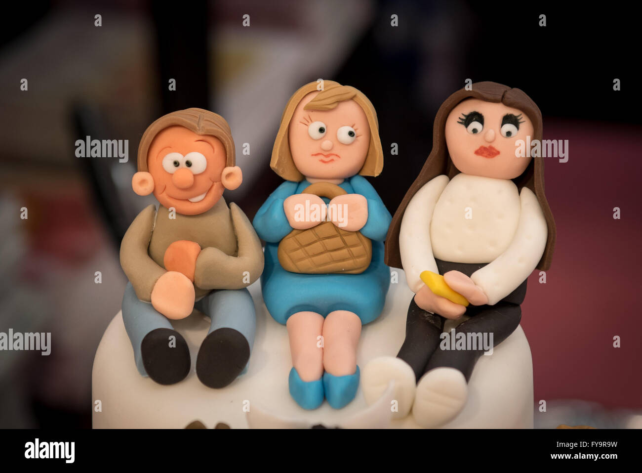 Family mum dad daughter cake decorations at Cake International – The Sugarcraft, Cake Decorating and Baking Show in London Stock Photo