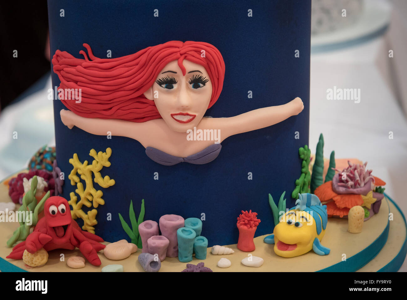 Mermaid princess Ariel birthday cake at Cake International – The Sugarcraft, Cake Decorating and Baking Show in London Stock Photo