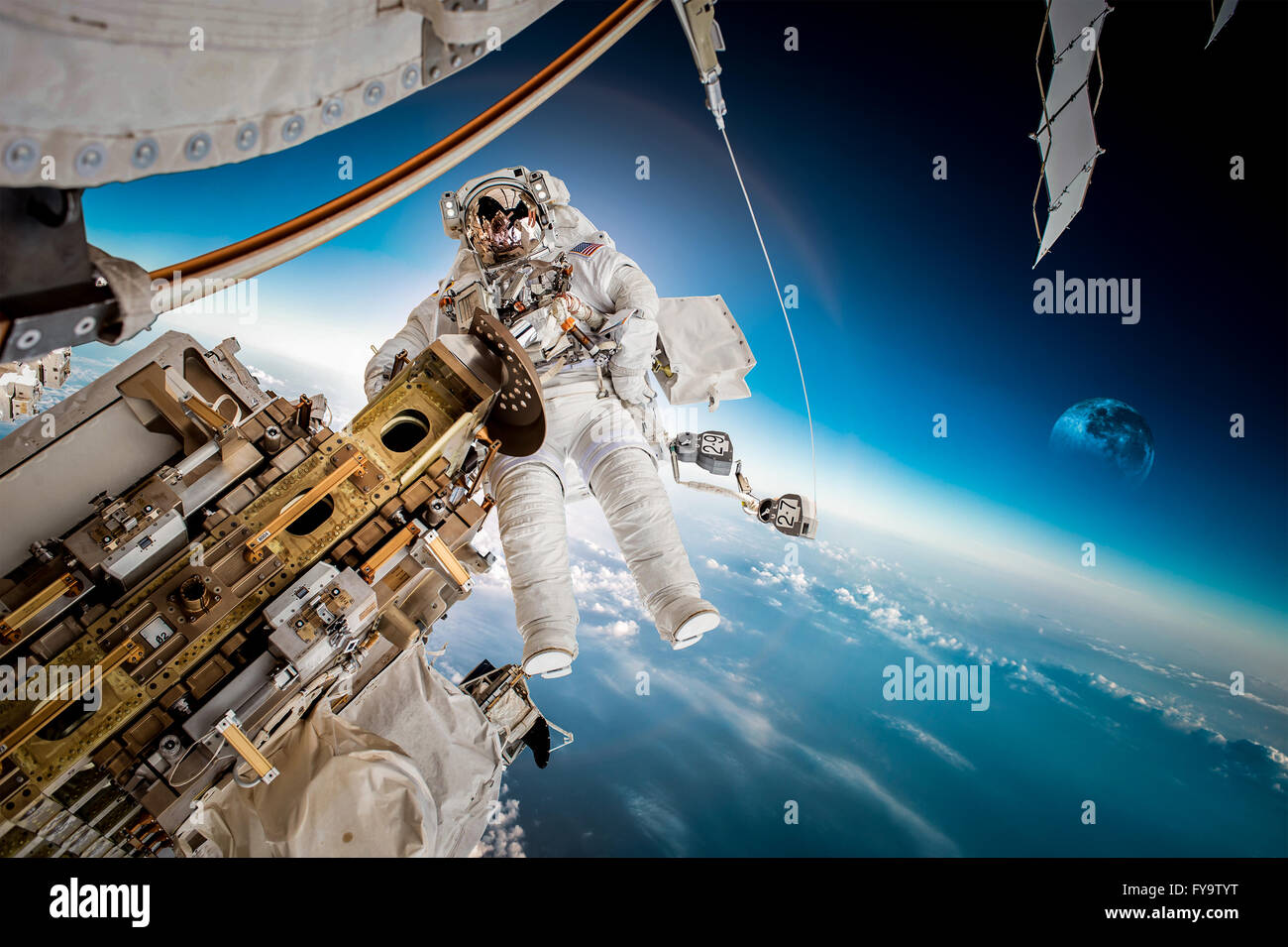 International Space Station and astronaut in outer space over the planet Earth. Elements of this image furnished by NASA. Stock Photo