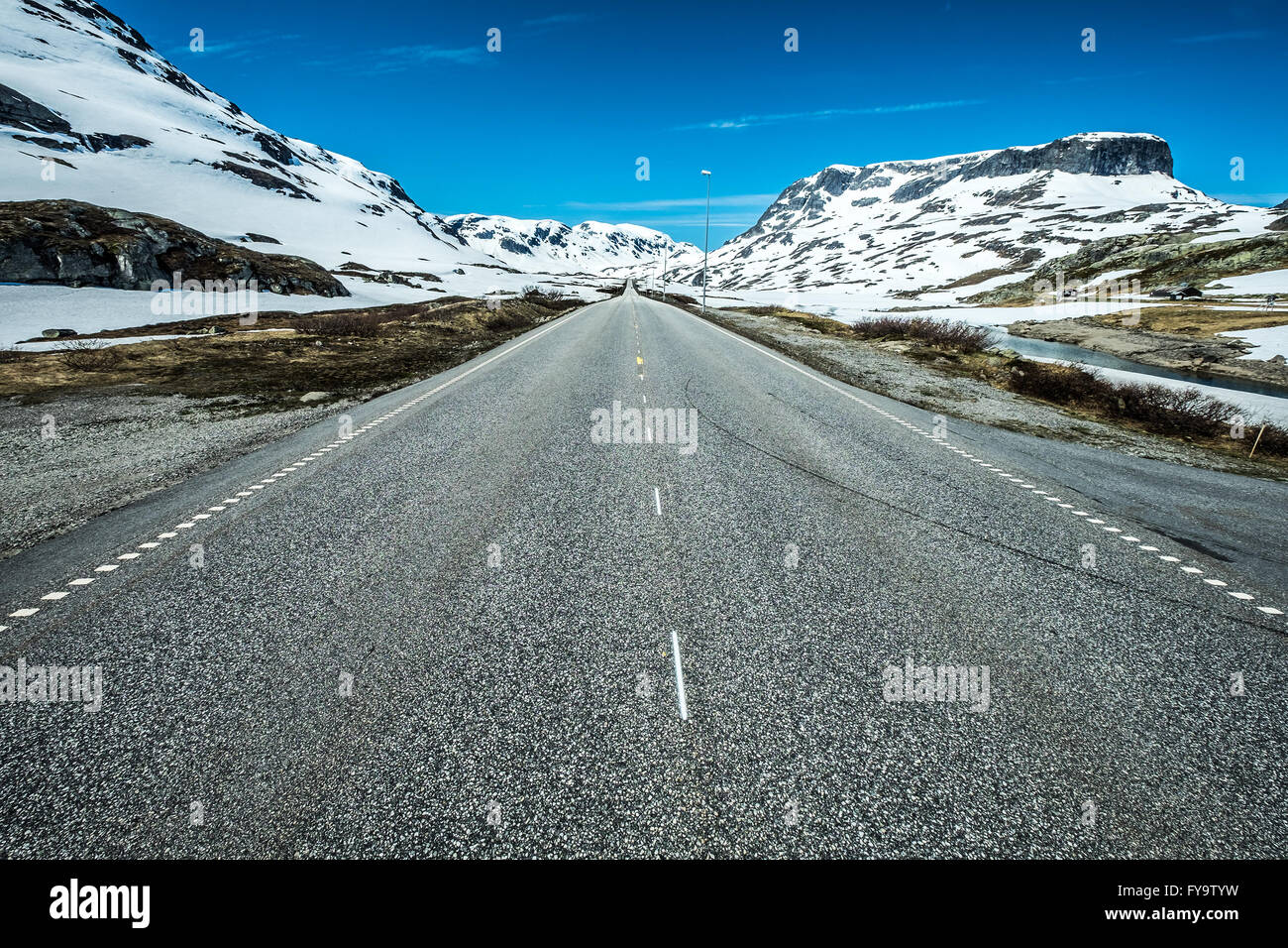 Mountain road in Norway, around the fog and snow. Stock Photo