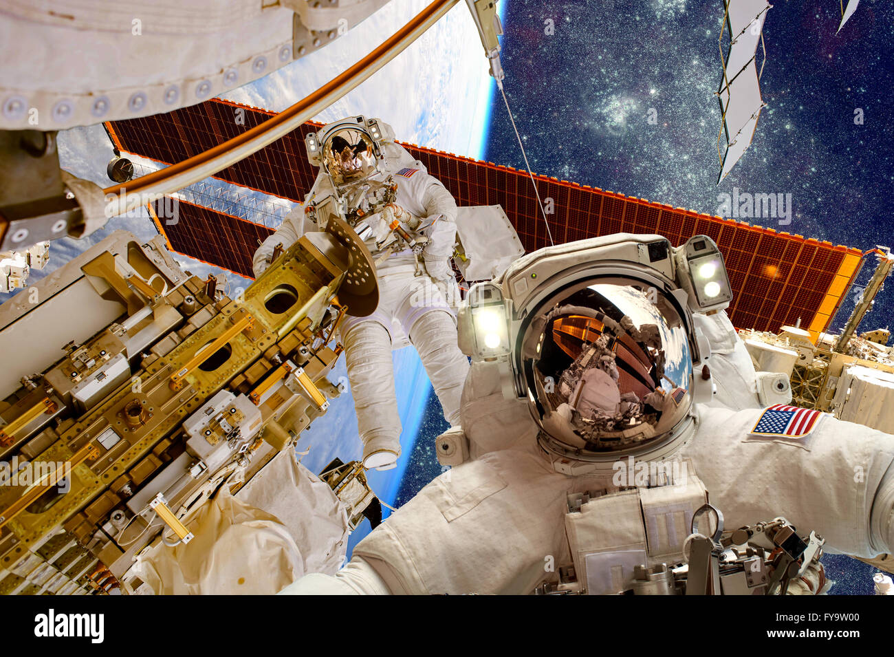International Space Station and astronaut in outer space over the planet Earth. Elements of this image furnished by NASA. Stock Photo