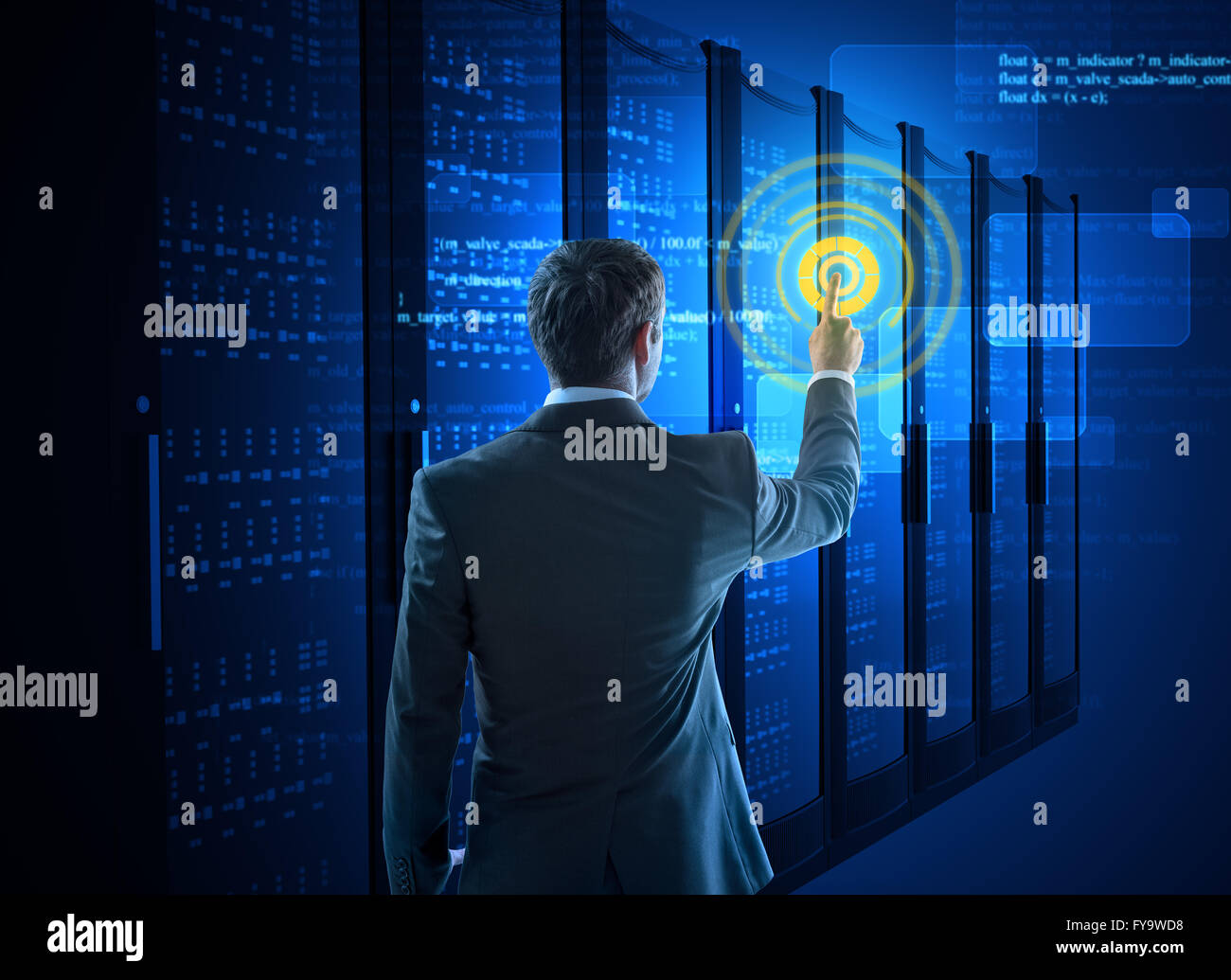 Business man using circle interface in data center Stock Photo