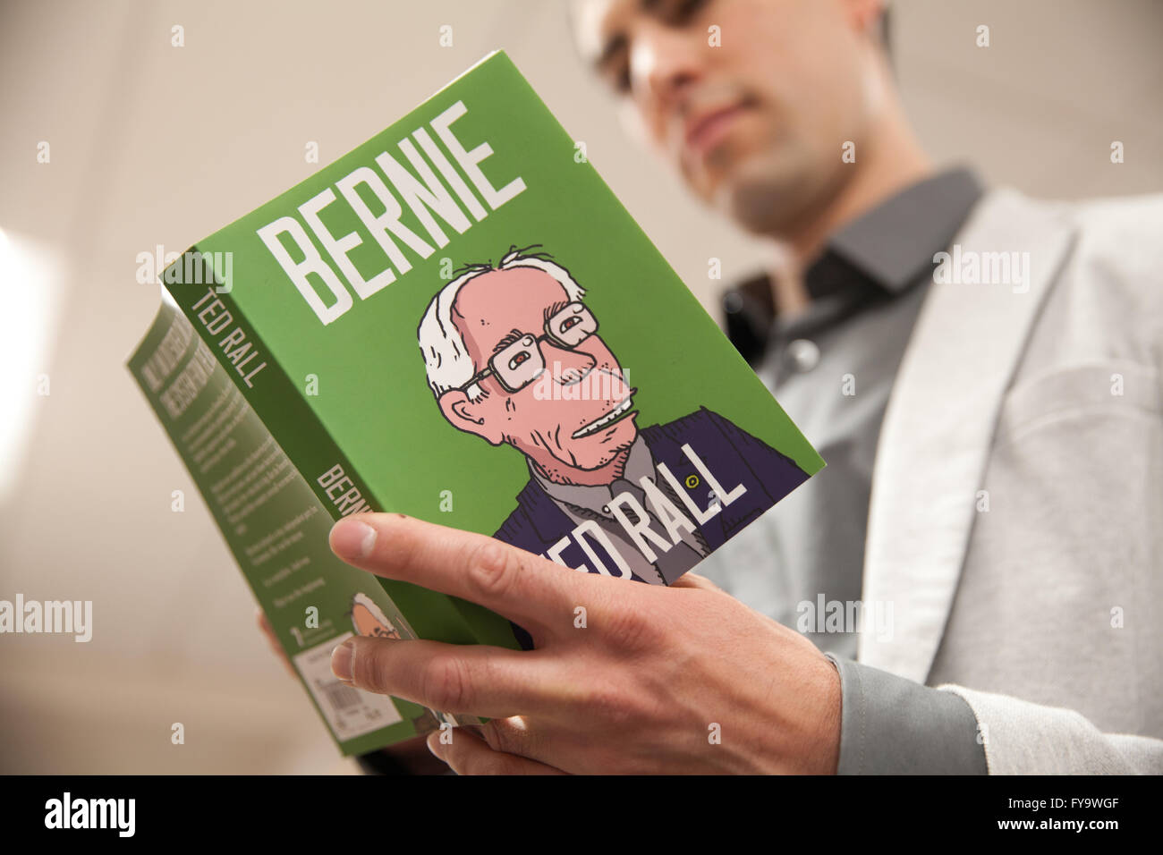Man reads book about Bernie Sanders. Stock Photo