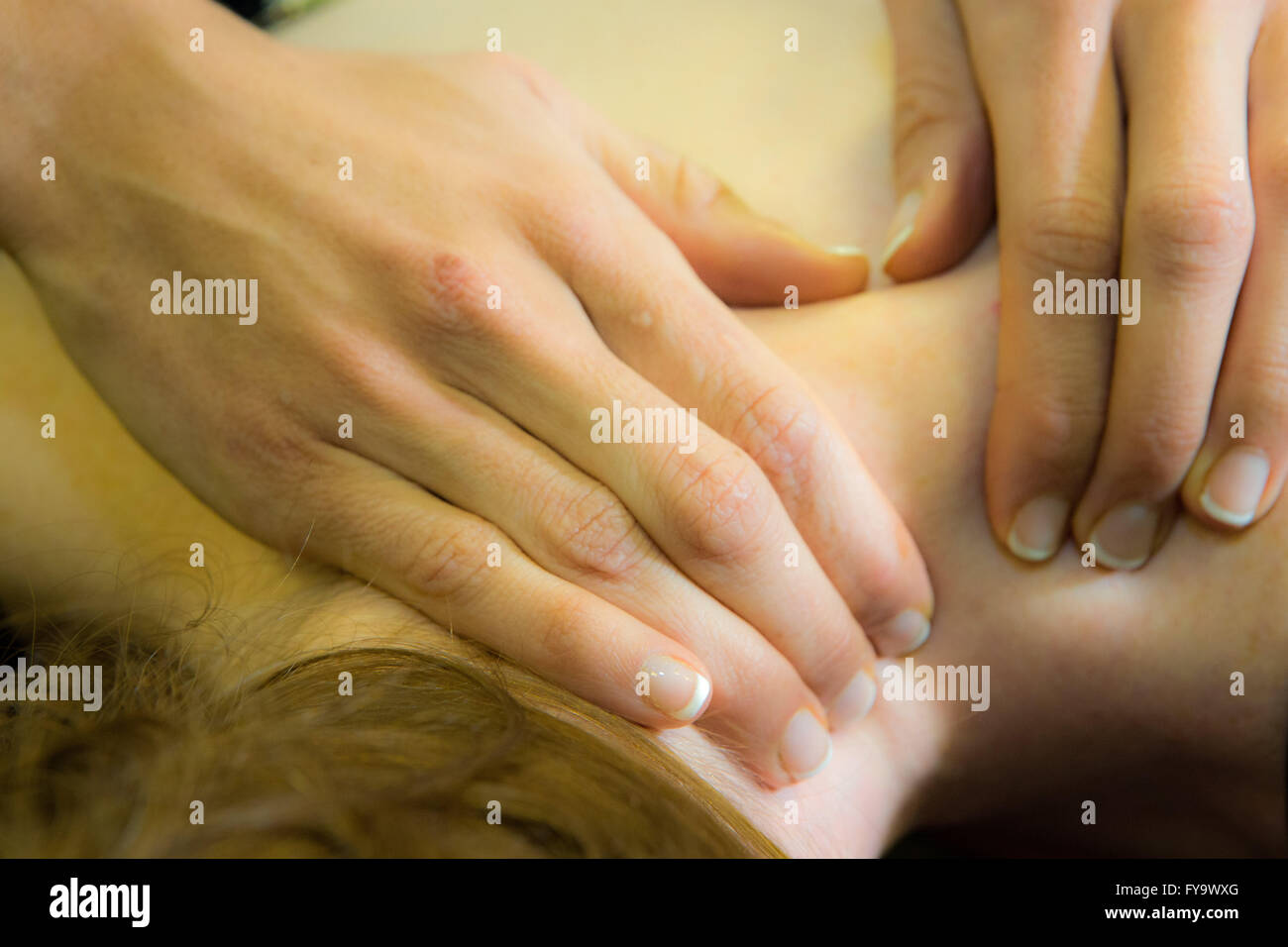 Woman receiving physiotherapy Stock Photo