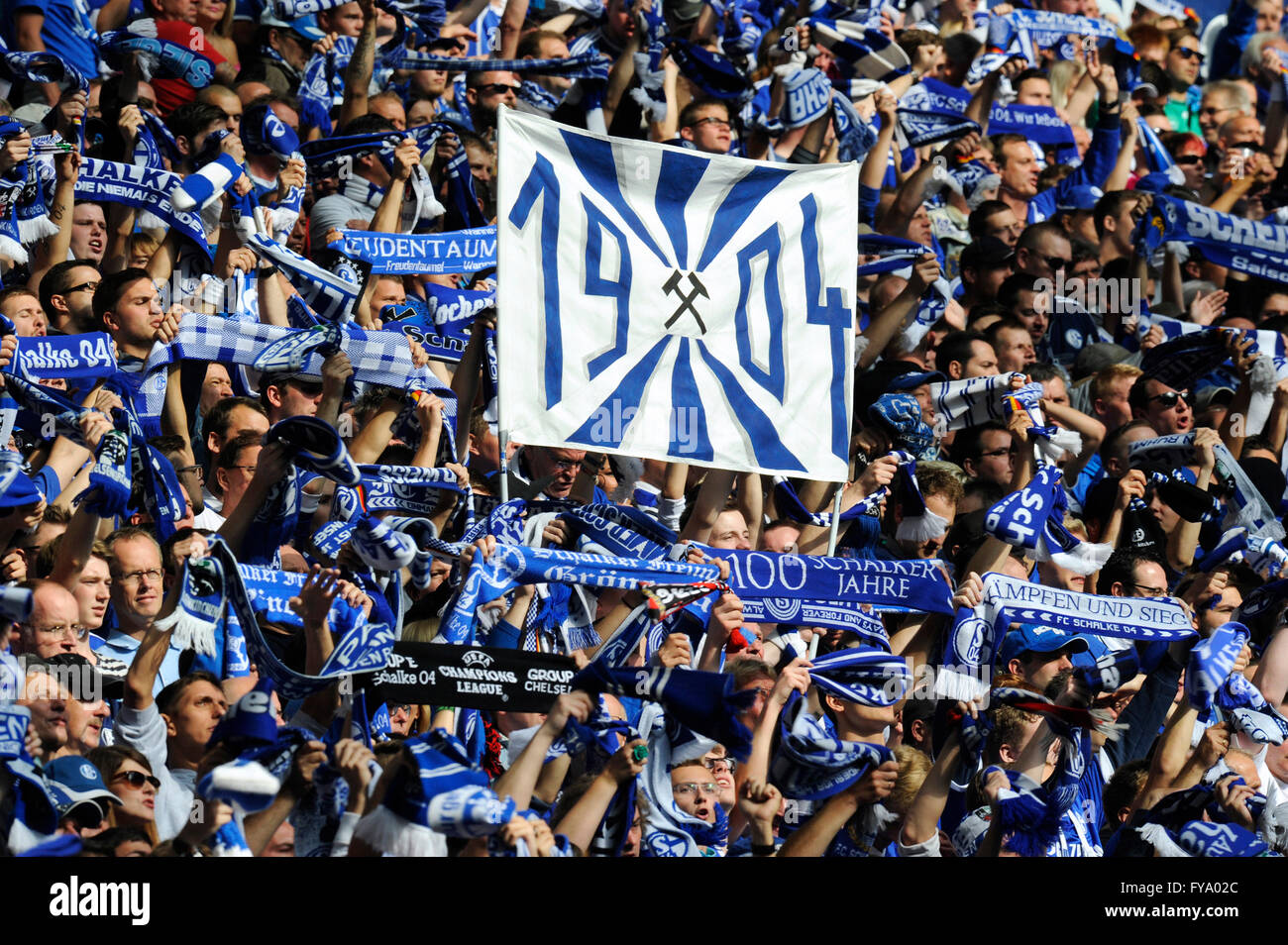 Schalke fans on the north stand holding up scarves and a banner "1904", FC  Schalke 04 - Borussia Dortmund, Veltins Arena Stock Photo - Alamy
