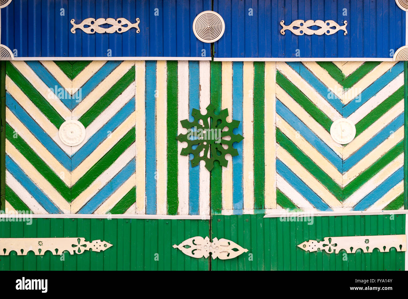 Traditional painted wooden door using Bashkir national flag colours and patterns found in the Republic of Bashkortostan in Russi Stock Photo