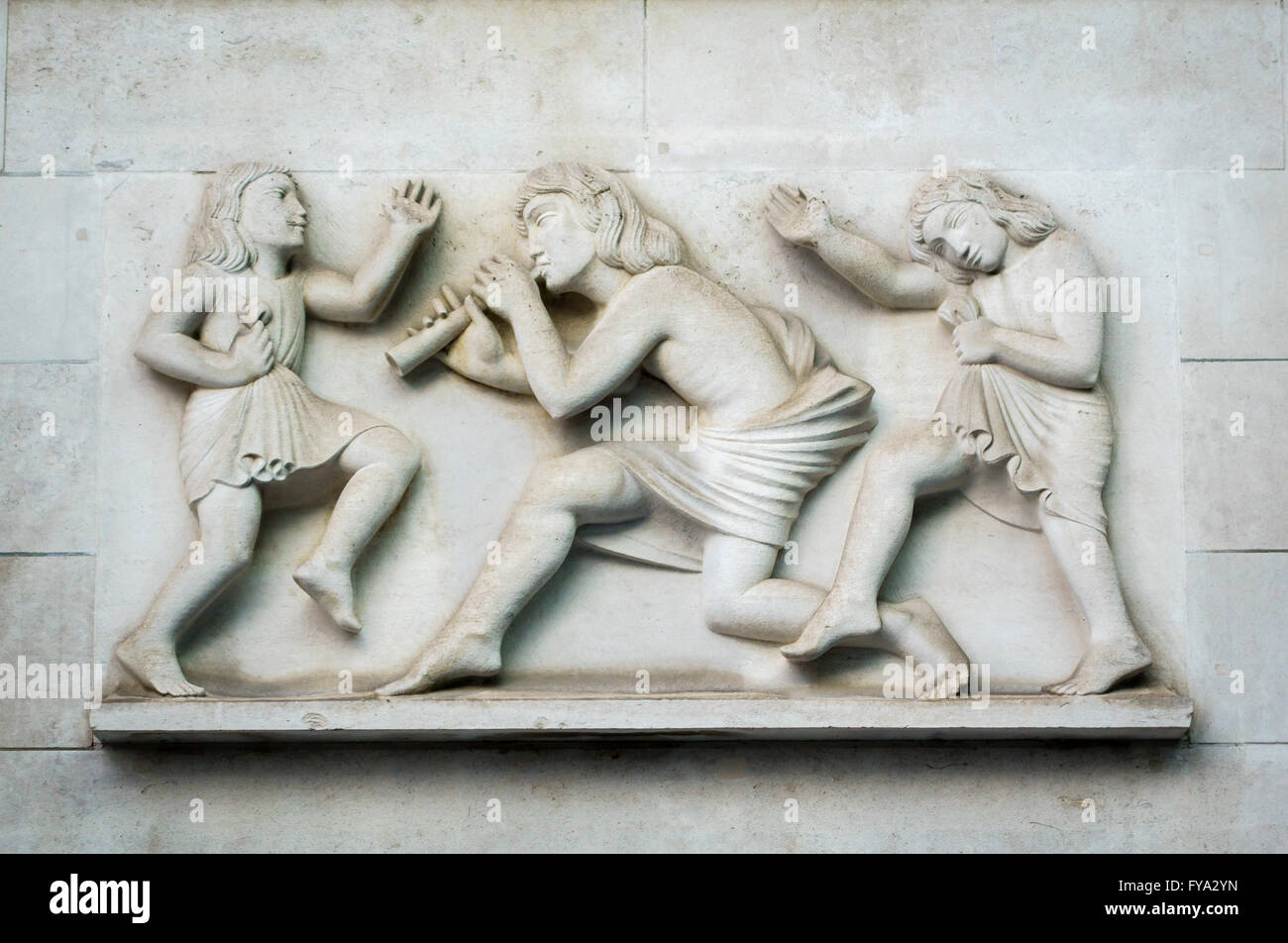 Broadcasting House, London, UK. Headquarters of the BBC, completed in 1932. 'Ariel Piping to the Children' by Eric Gill (1933) Stock Photo