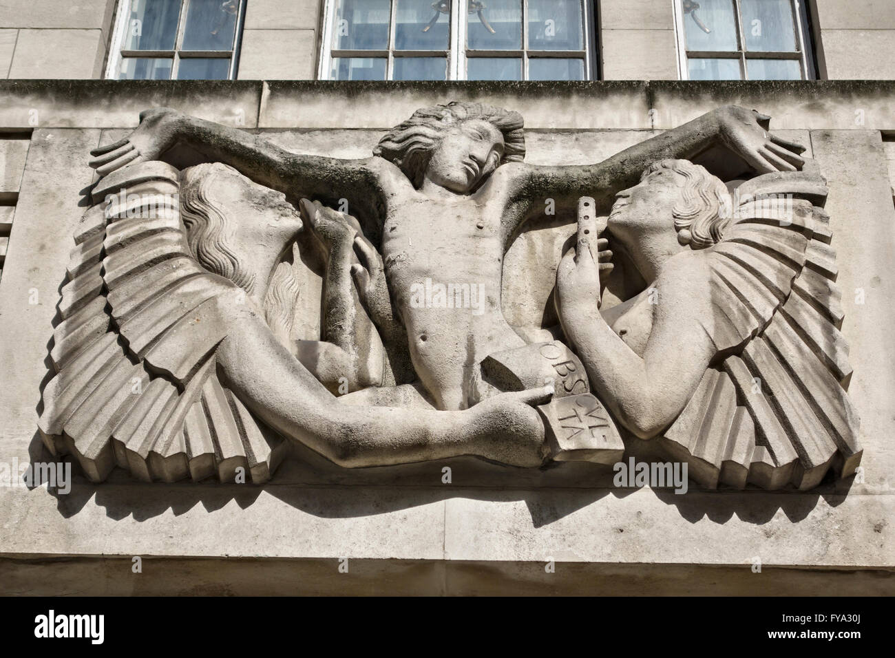 Broadcasting House, London. Headquarters of the BBC, completed in 1932. 'Ariel between Wisdom and Gaiety' by Eric Gill (1933) Stock Photo