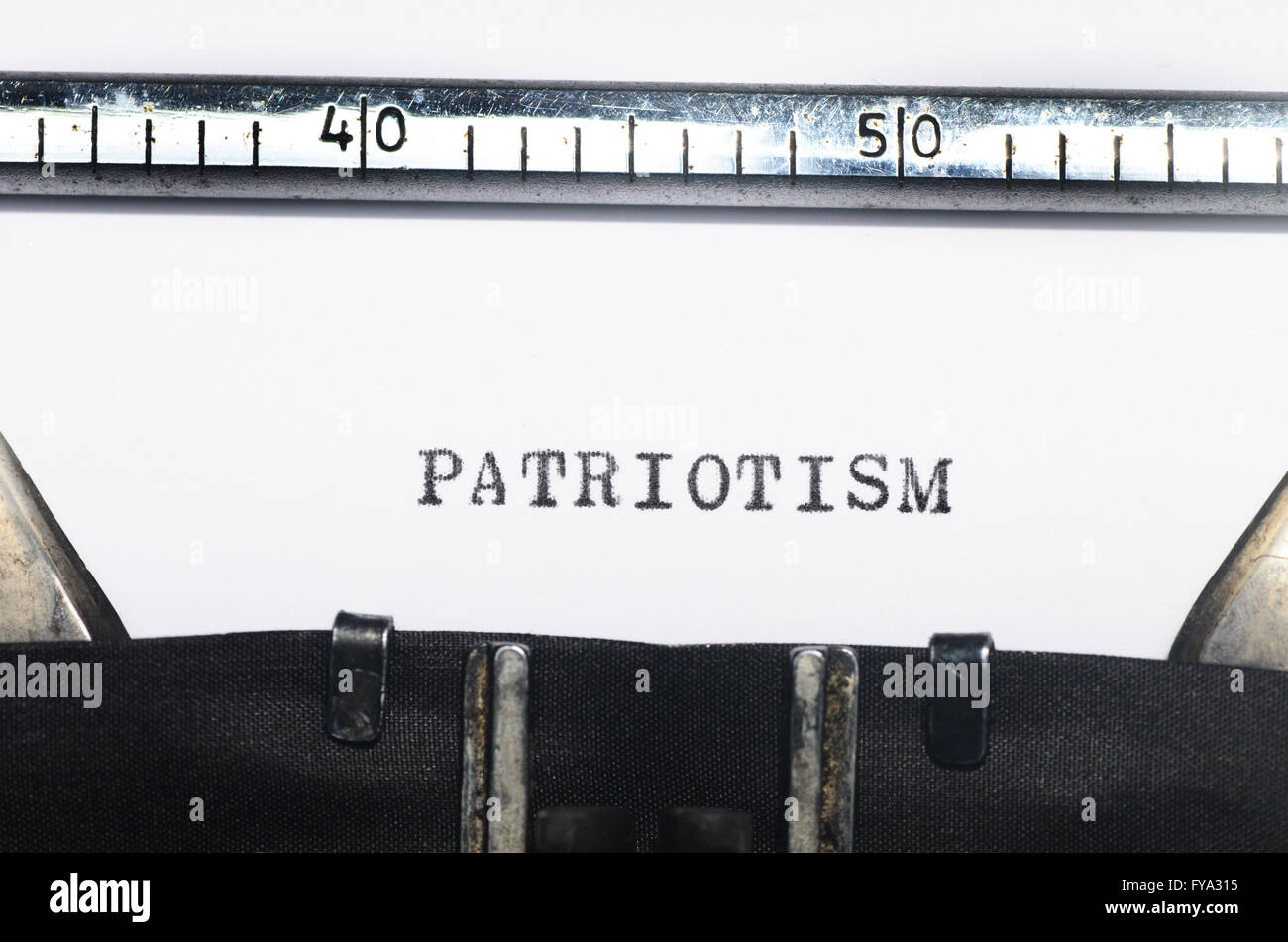 Word patriotism typed on an old typewriter Stock Photo