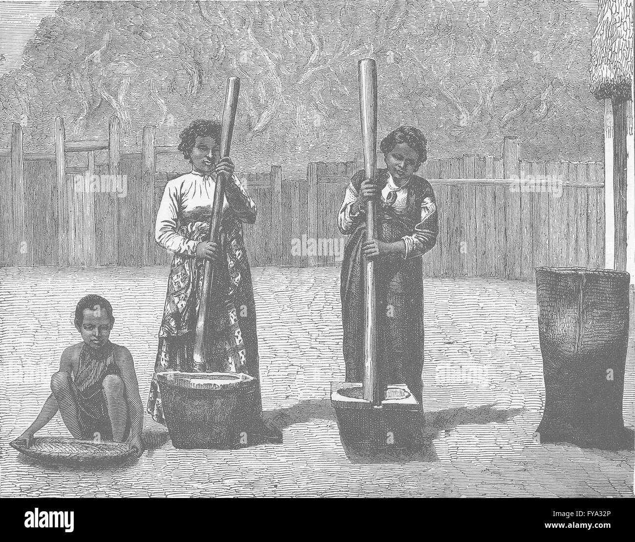 MADAGASCAR: Natives of Madagascar pounding rice, antique print 1890 Stock Photo