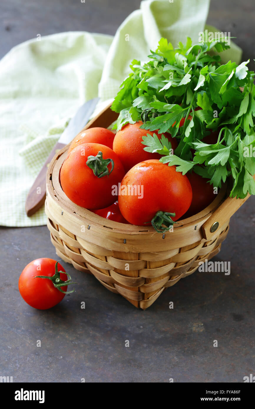 Juicy ripe organic tomatoes in a basket Stock Photo - Alamy