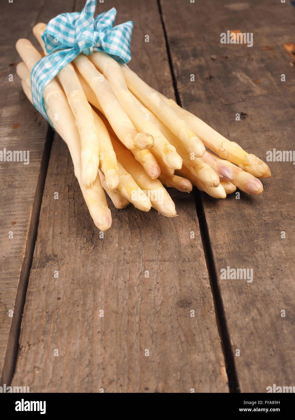 Bunch of white asparagus on an old wooden table Stock Photo