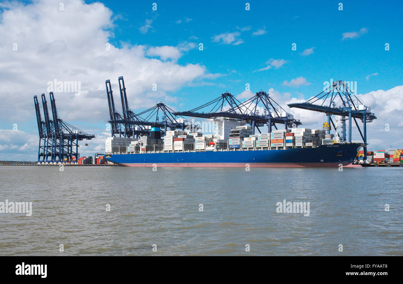View from the North Sea of the Port of Felixstowe in Suffolk and a container ship being loaded from the shore Stock Photo