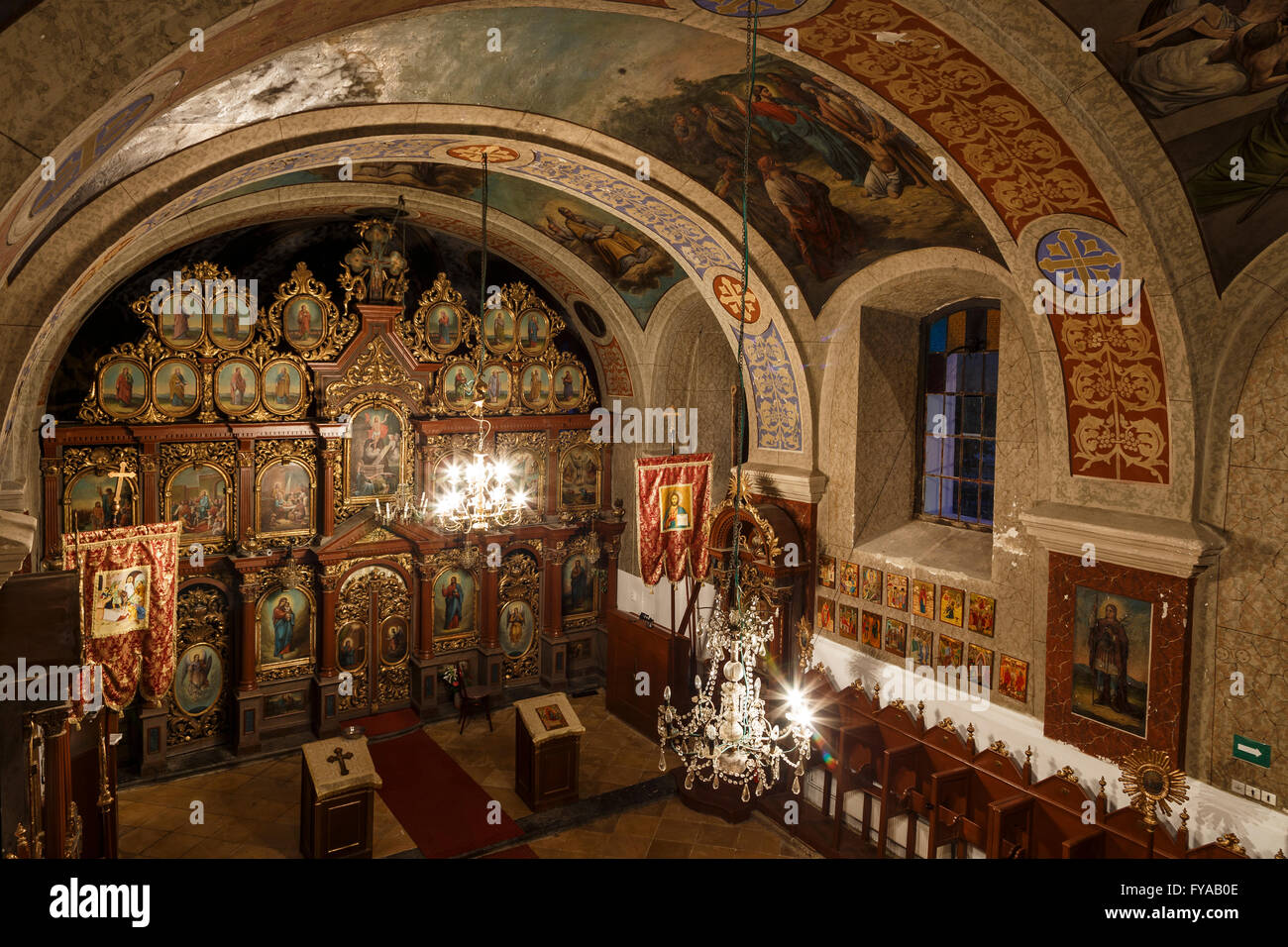 Interior of old Romanian orthodox church in evening Stock Photo