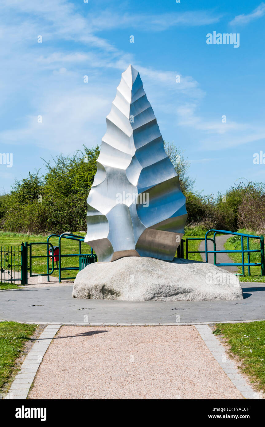 Sculpture of a hand axe at entrance to Heritage Park