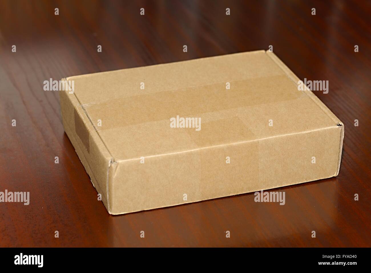 Cardboard Box on Desk Stock Photo