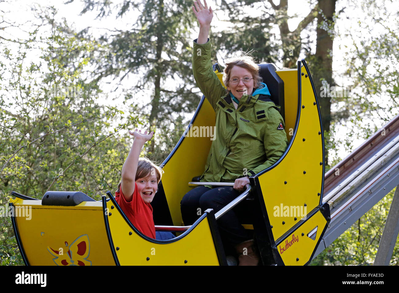 mother and child in playground ride, zoo ´Schwarze Berge´, Rosengarten, Lower Saxony, Germany Stock Photo