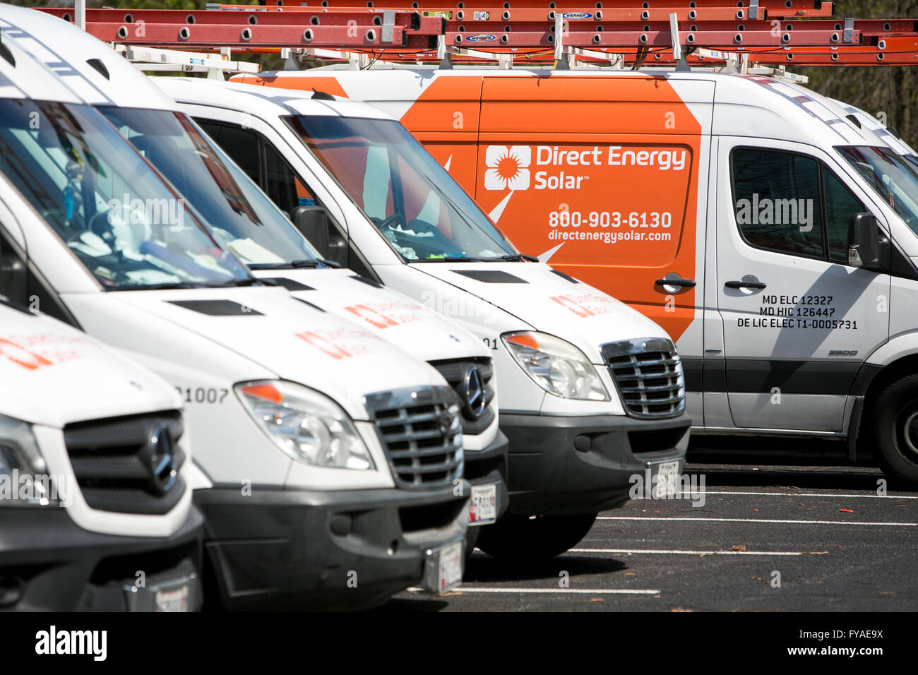 Work vans featuring Direct Energy Solar logos in Columbia, Maryland on April 10, 2016. Stock Photo