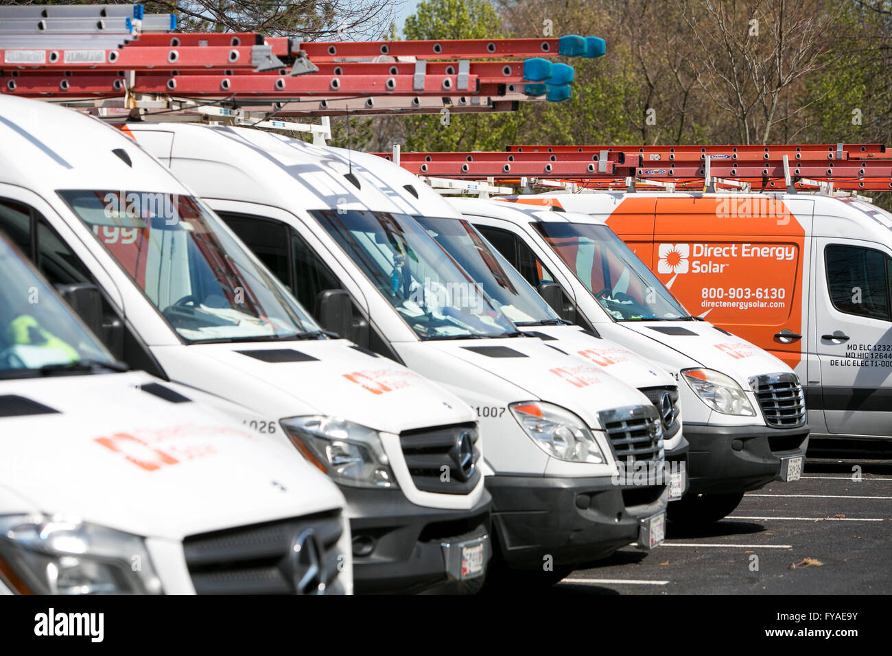 Work vans featuring Direct Energy Solar logos in Columbia, Maryland on April 10, 2016. Stock Photo