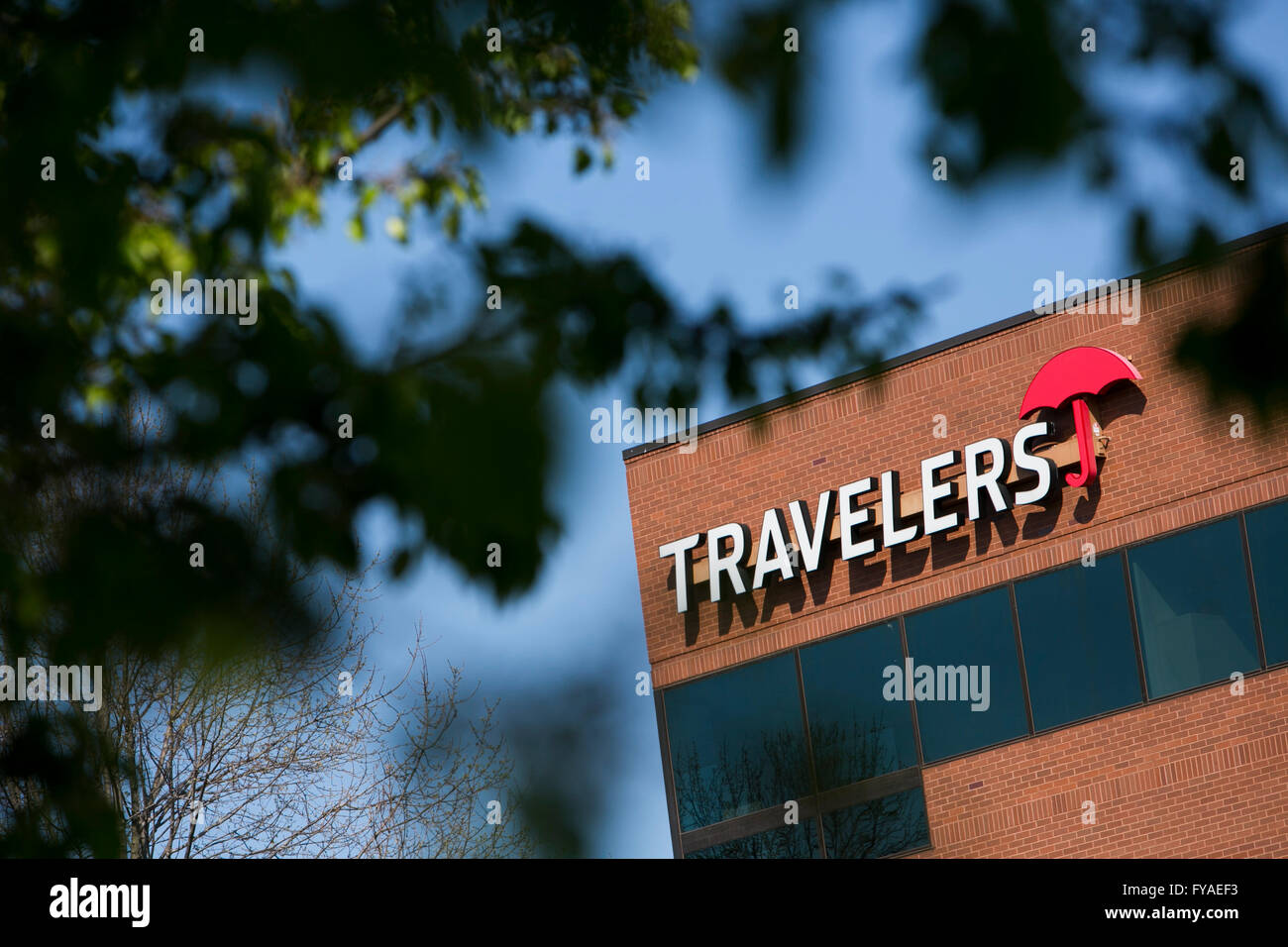 A logo sign outside of a facility occupied by The Travelers Companies