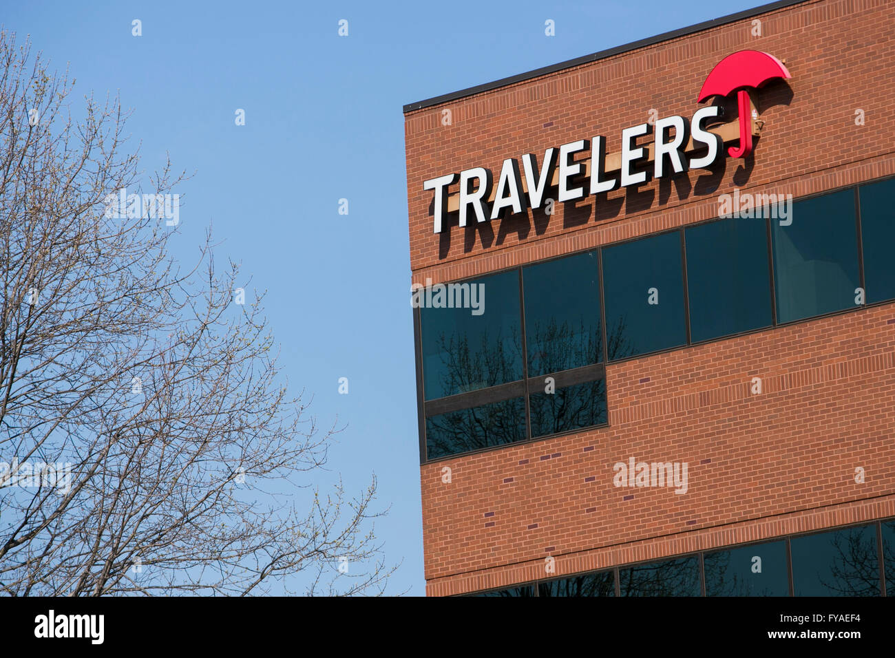 A logo sign outside of a facility occupied by The Travelers Companies