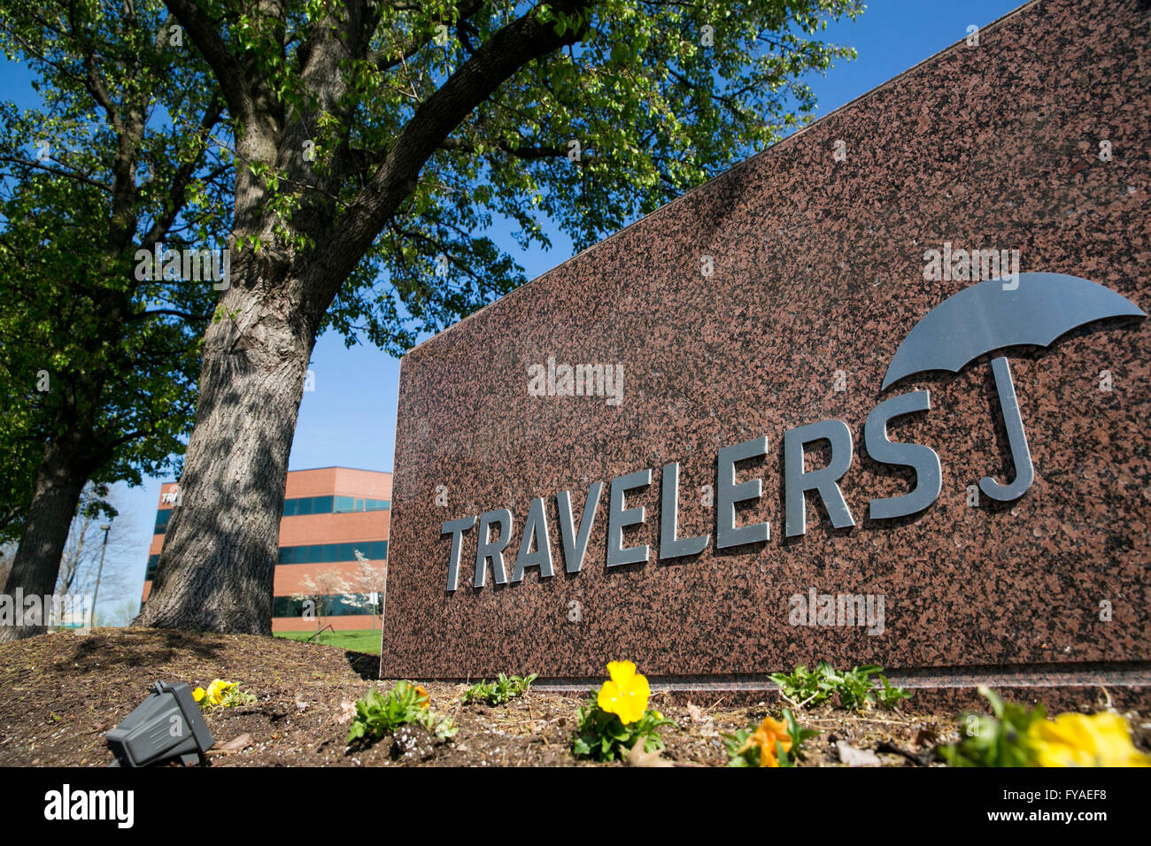 A logo sign outside of a facility occupied by The Travelers Companies