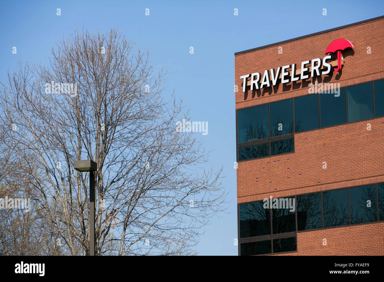 A logo sign outside of a facility occupied by The Travelers Companies