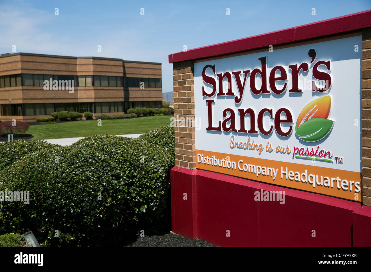 A logo sign outside of the distribution headquarters of Snyder's-Lance, Inc., in Hanover, Pennsylvania on April 17, 2016. Stock Photo