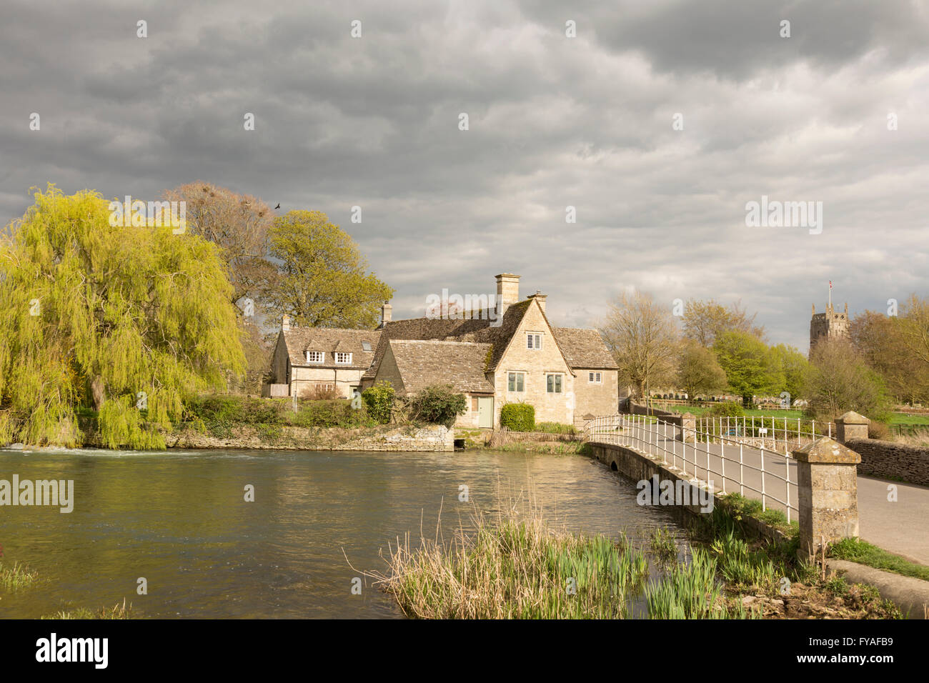 Fairford Mill and the River Coln in the small Cotswold town of Fairford, Gloucestershire, England, UK Stock Photo