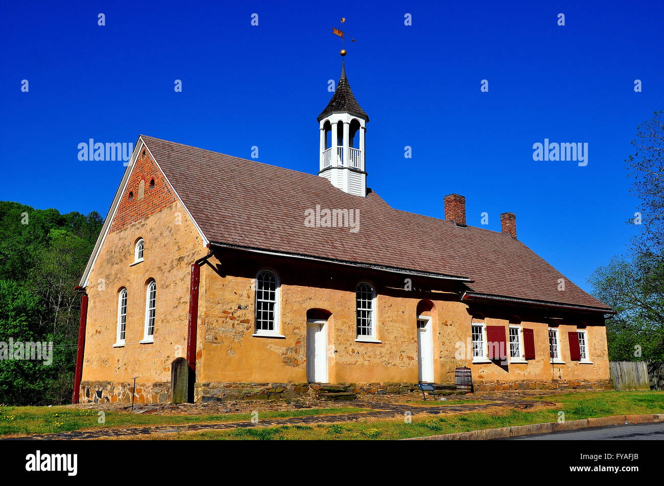 Bethabara, North Carolina: 1788 Gemeinhaus Moravian Church with attached minister's house at Bethabara historic settlement * Stock Photo