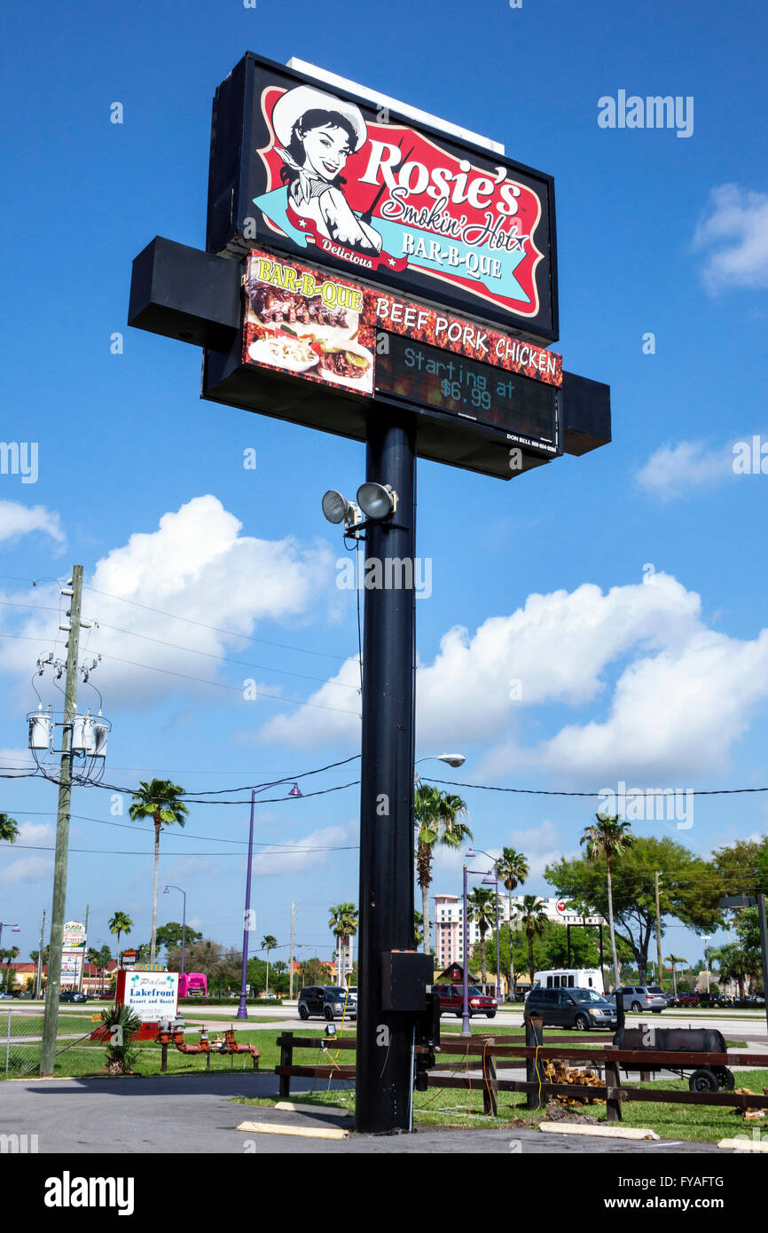 Florida,South,FL,Kissimmee,Orlando,highway billboard sign,pole,Rosie's Smokin' Hot Bar-b-que,restaurant restaurants food dining eating out cafe cafes Stock Photo