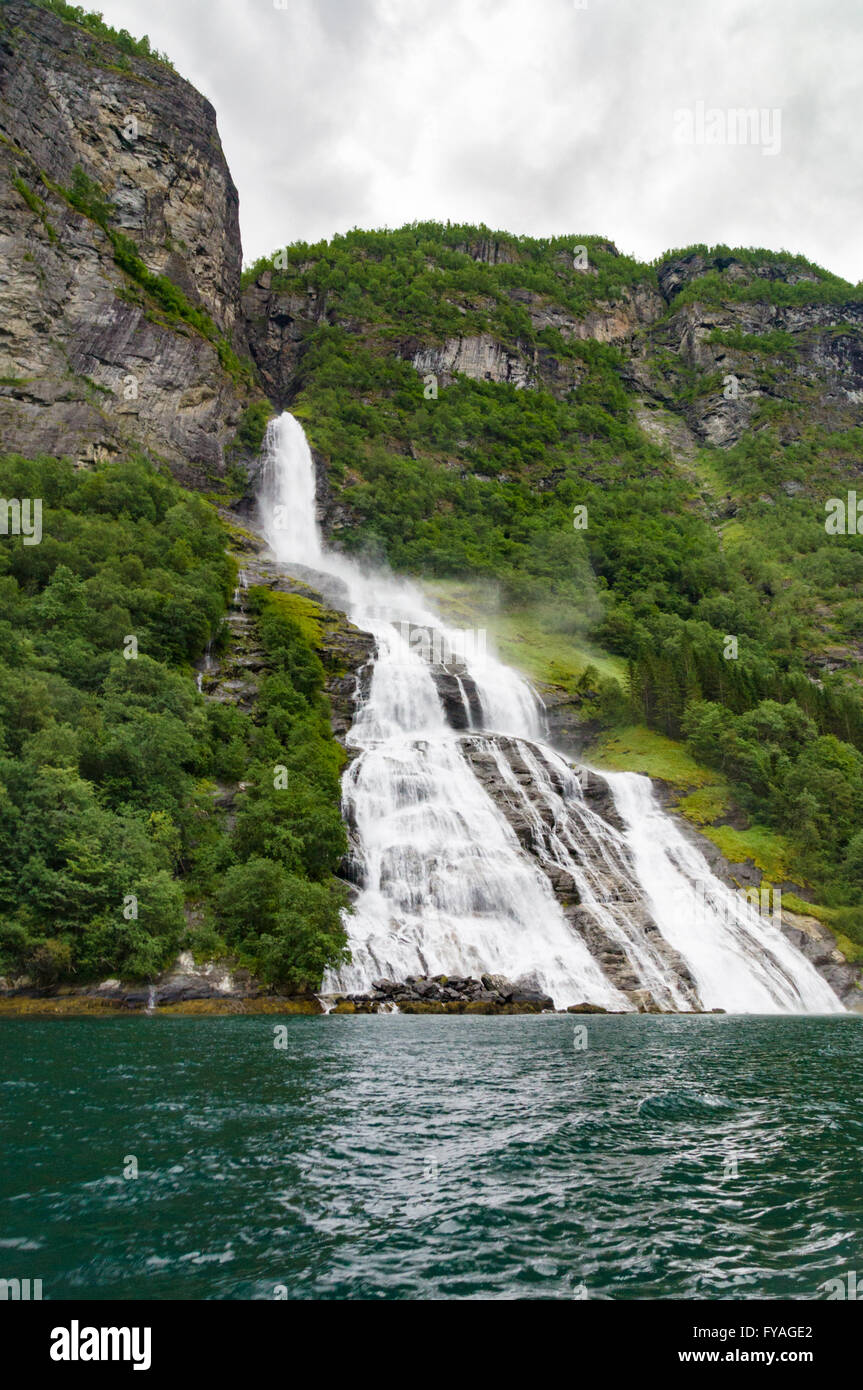 Waterfall called The Suitor flowing into Geirangerfjord, Norway Stock Photo