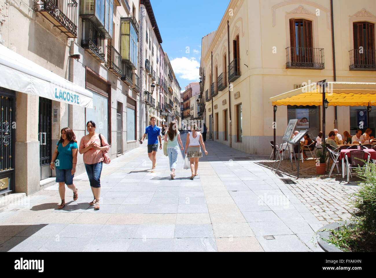 People walking along a street. Avila, Spain. Stock Photo