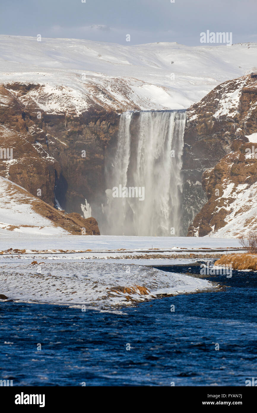 Skogafoss, 63 m high waterfall situated on the Skógá River in winter, Skógar, Iceland Stock Photo