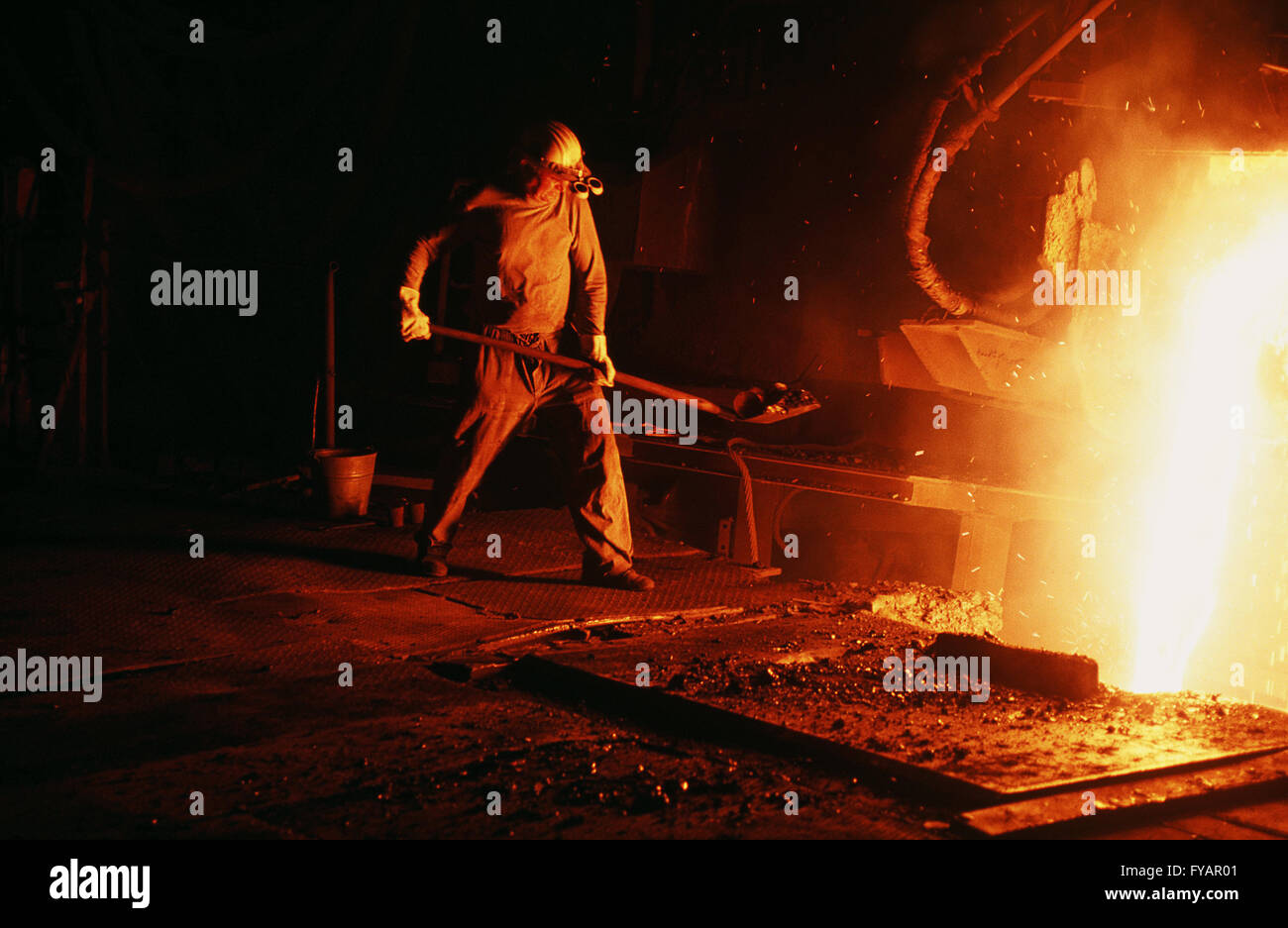Germany, Velbert, Krupp steel production. Worker wearing protective