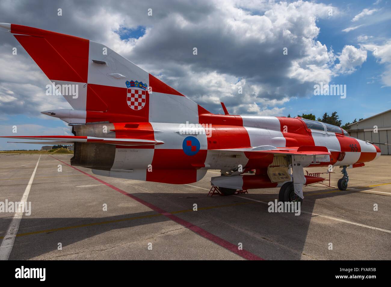 MiG21 MiG-21 MiG 21 UMD Croatian Air Force display fighter with white red squares apron 165 concrete apron parked wop Stock Photo