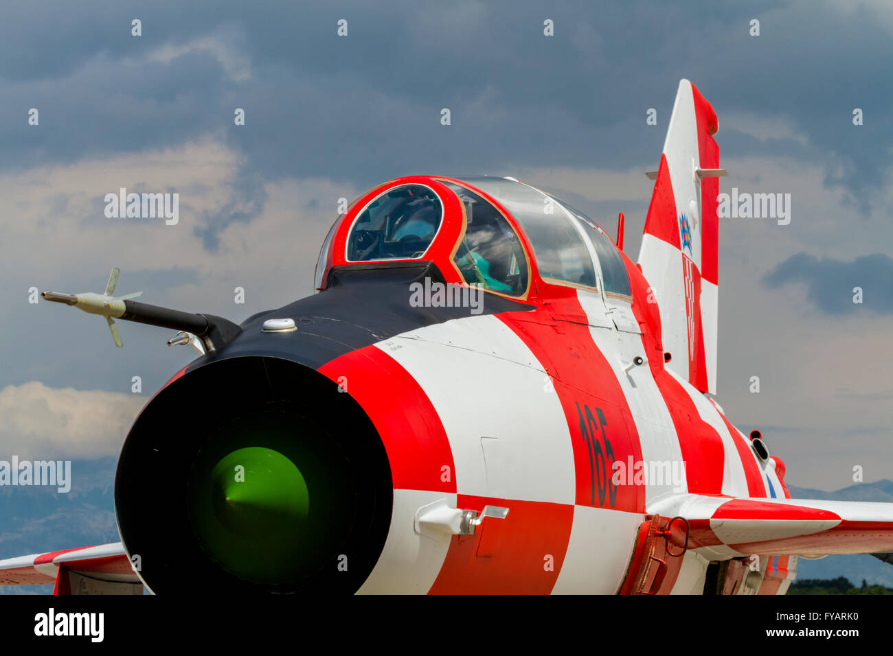 MiG21 MiG-21 MiG 21 UMD Croatian Air Force display fighter with white red squares apron 165 concrete apron parked wop nose Stock Photo