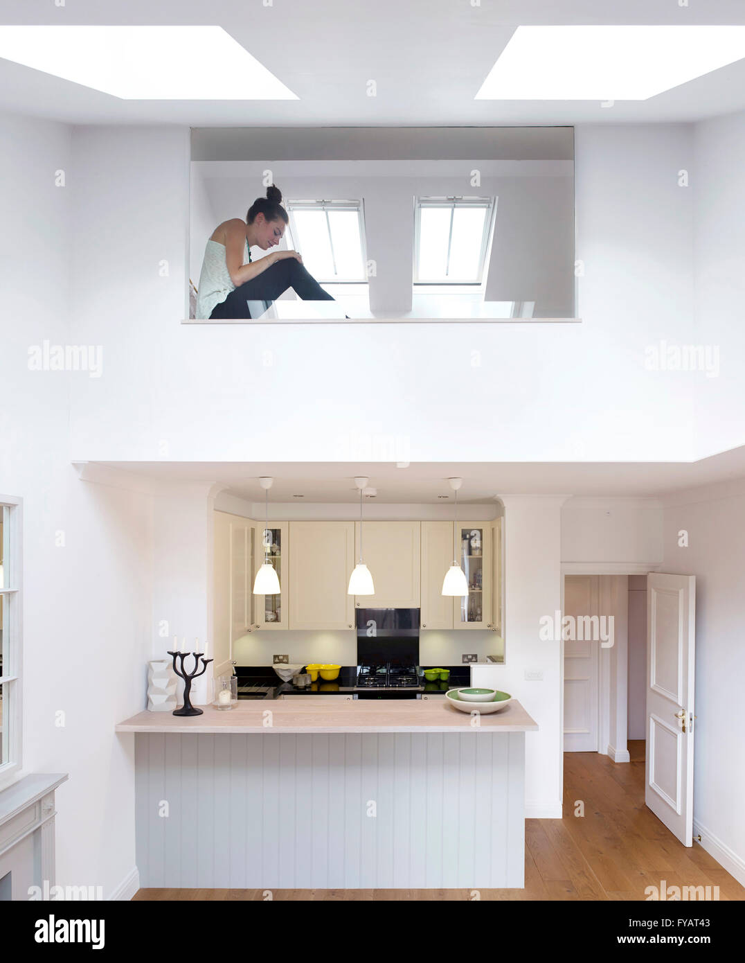 Kitchen and projecting bedroom with big window. Courtfield Road, LONDON, United Kingdom. Architect: Urban Projects Bureau, 2014. Stock Photo